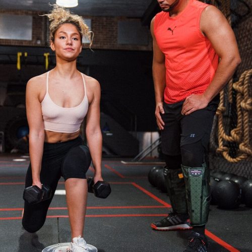 a man and a woman in a gym